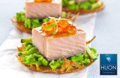 Huon hot smoked salmon on rosti with crushed peas, zucchini and salmon roe